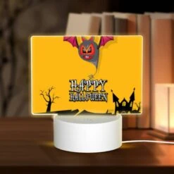 Rectangular Acrylic Night Light, A Halloween Banner With A Bat And A Pumpkin.