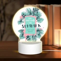 Round Acrylic Night Light, A Colorful Poster That Says "Say Hello To Summer" With A Palm Tree On It.