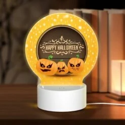 Round Acrylic Night Light, Three Pumpkins With Scary Faces On Them.