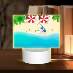 Rectangular Acrylic Night Light, A Red And White Umbrella Is Laying On The Beach.