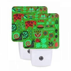 Night Light Set Of 2, A Green And Red Patterned Fabric With Various Plants And Animals On It.