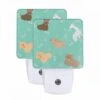 Night Light Set Of 2, A Collection Of Cartoon Dogs With Bones In Their Mouths.