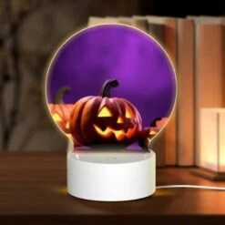Round Acrylic Night Light, A Group Of Pumpkins With Faces Drawn On Them.