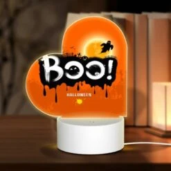 Love Acrylic Night Light, A Halloween Poster With A Spooky Scene And The Word "BOO!" Written On It.