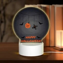 Round Acrylic Night Light, A Halloween Decoration With A Pumpkin And A Bat.