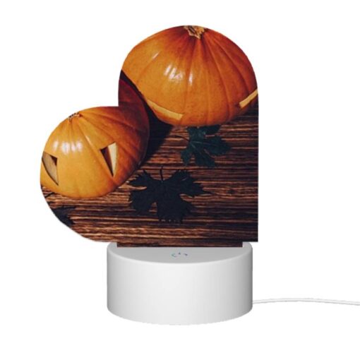 Love Acrylic Night Light, A Pumpkin With A Face Drawn On It Sits On A Table With Other Pumpkins. -Nuas Diy Shop 43a188bd765cf997ca3303f4666bd05574a60bf3