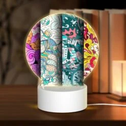 Round Acrylic Night Light, Four Different Colored Paintings Of Flowers.