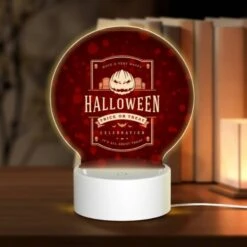 Round Acrylic Night Light, A Red And White Halloween Poster With A Pumpkin On It.