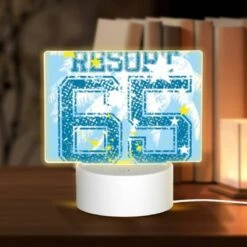 Rectangular Acrylic Night Light, A Blue And Yellow Shirt With The Number 66 On It.