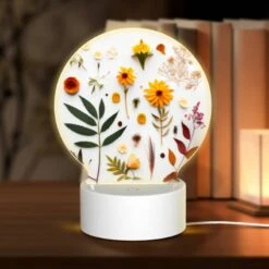 Round Acrylic Night Light, A Variety Of Flowers And Leaves Are Arranged On A White Surface.