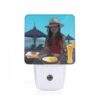 Night Light, A Woman Wearing A Hat Is Sitting At A Table With A Plate Of Food In Front Of Her. -Nuas Diy Shop 5f9c9716e78b88ab392a956f222899a6210da1f1