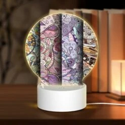 Round Acrylic Night Light, Four Different Colored Paintings Of Swirls And Designs.