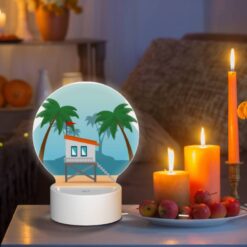 Round Acrylic Night Light, A Small White House With A Red Roof Is Situated On A Sandy Beach. -Nuas Diy Shop 63eabc5f3be443307e99b2ddcae33e40da2ebf8e