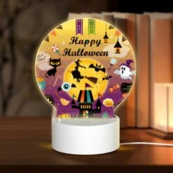Round Acrylic Night Light, A Colorful Poster With Halloween Decorations And A Witch On A Broom.