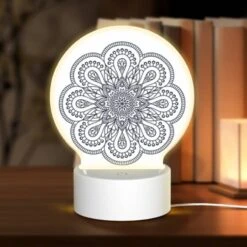 Round Acrylic Night Light, A Black And White Design Of A Flower.