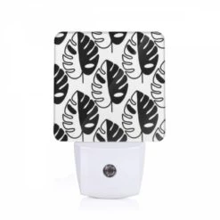 Night Light, A Pattern Of Leaves With A Black And White Background.