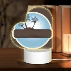 Love Acrylic Night Light, A Brown And White Circle With A Picture Of A Palm Tree On It.