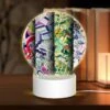 Round Acrylic Night Light, Four Colorful Designs Are Displayed In A Row.