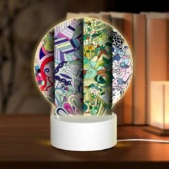 Round Acrylic Night Light, Four Colorful Designs Are Displayed In A Row.