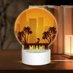 Round Acrylic Night Light, A Cityscape With A Beach Sign And Palm Trees.