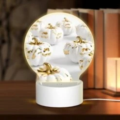 Round Acrylic Night Light, A Group Of Gold And White Pumpkins.
