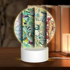 Round Acrylic Night Light, Three Colorful Paintings Are Displayed Side By Side.