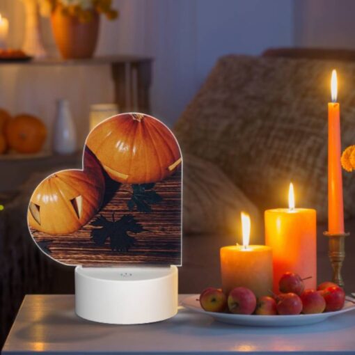Love Acrylic Night Light, A Pumpkin With A Face Drawn On It Sits On A Table With Other Pumpkins. -Nuas Diy Shop 9db47646035296f489f2a2f497420e91874381ea