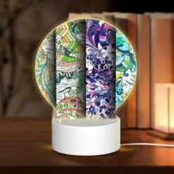 Round Acrylic Night Light, Three Colorful Designs Are Displayed On A Row.
