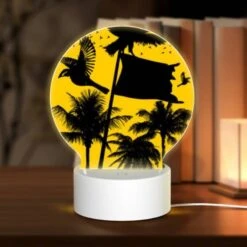 Round Acrylic Night Light, A Black And White Image Of A Bird Flying In Front Of A Yellow Flag.