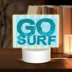 Rectangular Acrylic Night Light, A Blue And White Surfboard With The Word "go" On It.