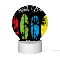 Round Acrylic Night Light, A Black And White Image Of A Surfboard With The Words Florida Beach Paradise Lost Written On It. -Nuas Diy Shop a738ac9594afe38f3f9c0d1899ef5ee186163d6b