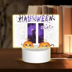 Rectangular Acrylic Night Light, Two Pumpkins Are Sitting In Front Of A Window