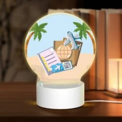 Round Acrylic Night Light, A Collection Of Travel Documents And A Suitcase Are Placed On A Sandy Beach.