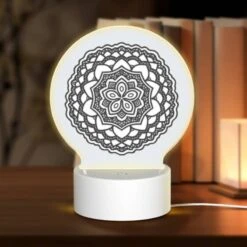 Round Acrylic Night Light, A Black And White Design Of A Flower.