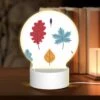 Round Acrylic Night Light, Six Different Colored Leaves Are Shown In A Row.
