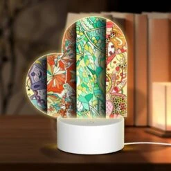 Love Acrylic Night Light, Four Different Colored Designs Of Flowers Are Displayed On A Wall.