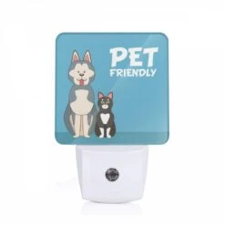 Night Light, A Black And White Cat And A Dog Are Standing Next To Each Other.