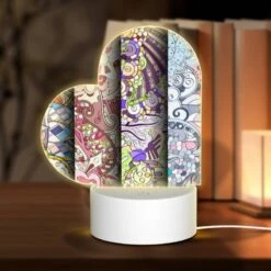 Love Acrylic Night Light, Three Colorful Designs Are Displayed On A Roll Of Paper.