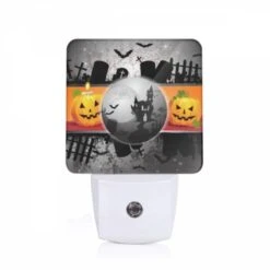 Night Light, A Black And White Image Of A Pumpkin And A Castle.