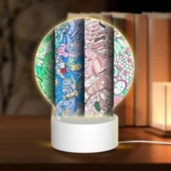 Round Acrylic Night Light, Four Colorful Designs Are Displayed On A Row.