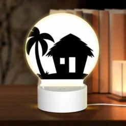 Round Acrylic Night Light, A Black And White Image Of A House With A Palm Tree In Front Of It.