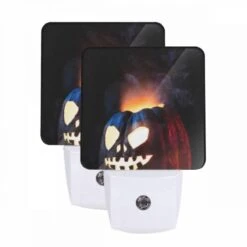 Night Light Set Of 2, A Carved Pumpkin With A Face And A Flame In The Background.