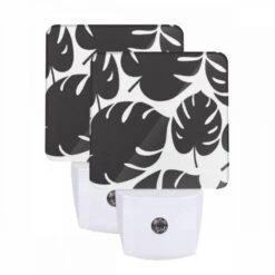 Night Light Set Of 2, A Pattern Of Leaves On A Black And White Background.