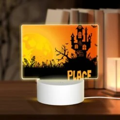 Rectangular Acrylic Night Light, A Spooky Halloween Scene With A Haunted House And Bats Flying Around.